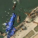 North Korea deploys mystery balloon-like objects to stricken warship, satellite photos show