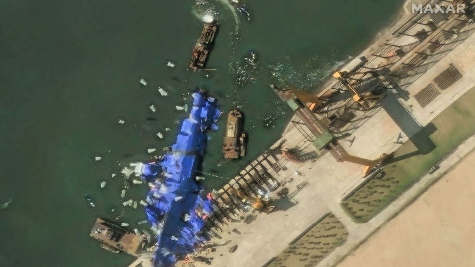 North Korea deploys mystery balloon-like objects to stricken warship, satellite photos show