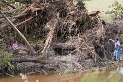 Texas flood rescue teams continue to search for scores of missing people as death toll climbs