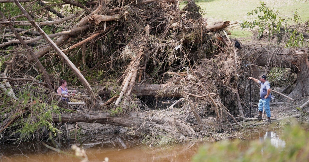 Texas flood rescue teams continue to search for scores of missing people as death toll climbs