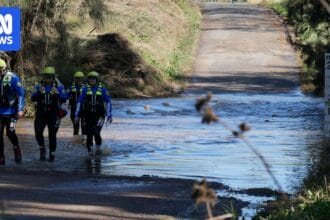 Body found in search for woman swept away by floodwaters near Cessnock
