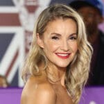 Helen Skelton has silver hair glow as she walks the red carpet with grey fox Gethin Jones