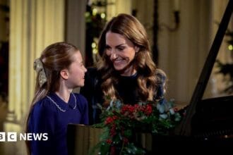 Catherine and Charlotte perform Christmas carol service piano duet