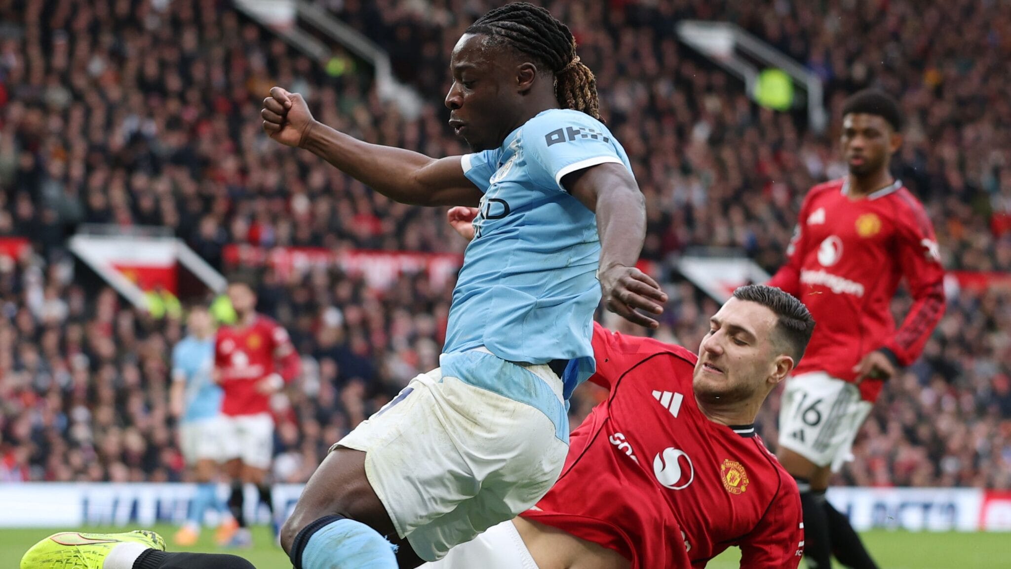 How Man Utd’s Diogo Dalot escaped Manchester derby red card for brutal high challenge on Man City’s Jeremy Doku as fans are left in utter disbelief