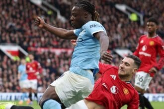 How Man Utd’s Diogo Dalot escaped Manchester derby red card for brutal high challenge on Man City’s Jeremy Doku as fans are left in utter disbelief