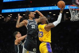 Doncic, James help Lakers rout Nets in Reaves’ return from injury