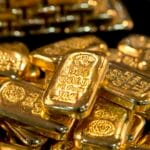 Gold falls 4% as strong dollar and higher rate bets undercut safe-haven demand
