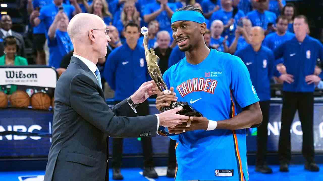 Shai Gilgeous-Alexander receives MVP trophy from NBA Commissioner Adam Silver